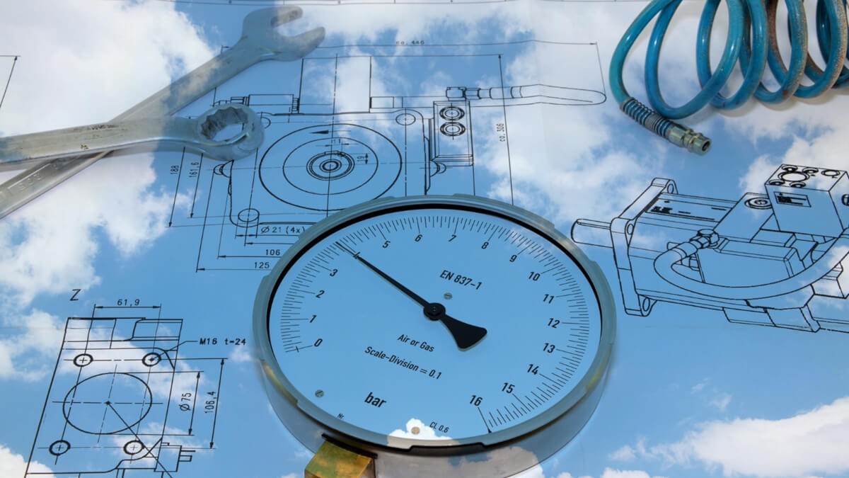 Manometr wskazujący niebezpieczny wzrost ciśnienia Manometr na instalacji pneumatycznej, którego wskazówka znajduje się w czerwonym polu, sygnalizując niebezpieczny wzrost ciśnienia spowodowany wzrostem temperatury medium